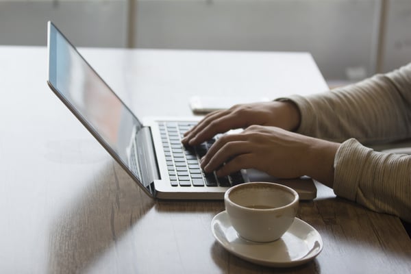 training on computer with coffee